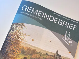 Logo des Dekanats BIG mit Kirche und Ortsnamen.
